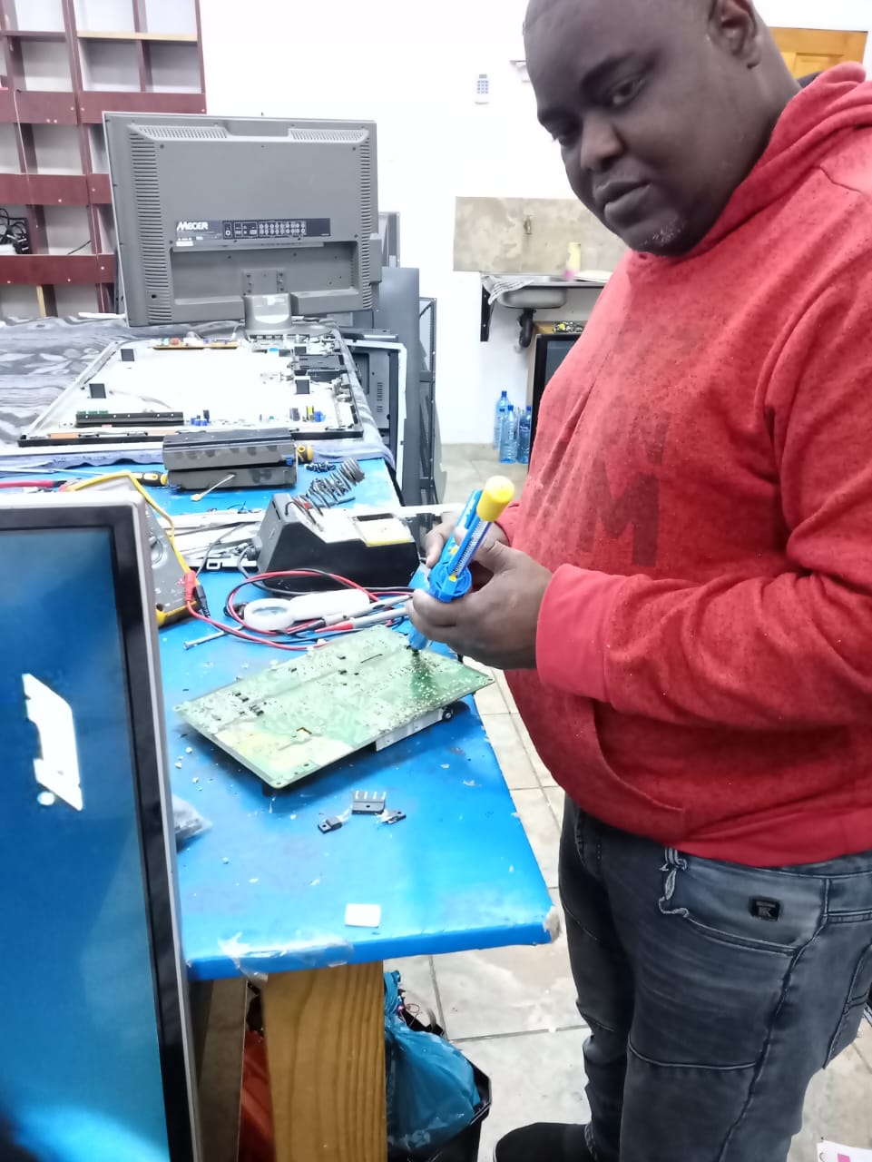 Technician repairing a washing machine